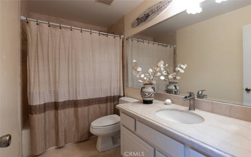 Upstairs full bathroom services the family room and secondary bedroom