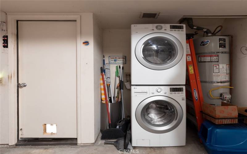 Direct access from the kitchen to the 2-car garage with hi-end stacked LG washer/dryer