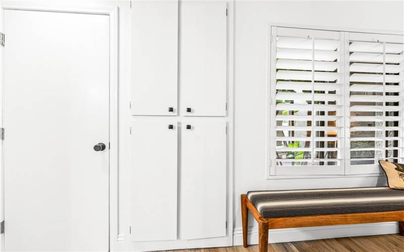 laundry closet and large linen closet