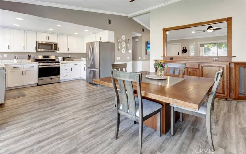 Wide open family/dining room facing the kitchen.