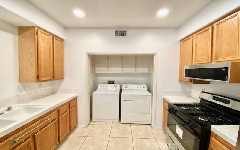 Laundry is located inside closet off of the kitchen area.