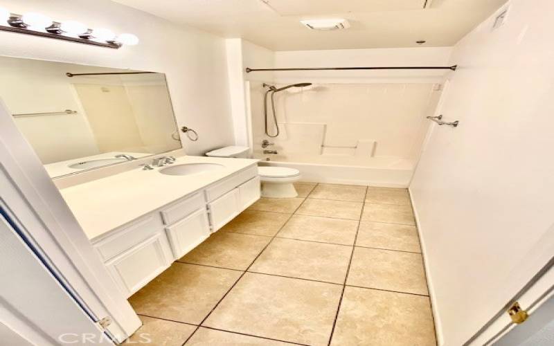 Second bathroom has a shower in tub.