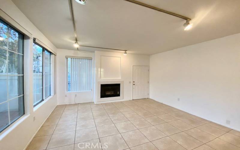 Living room area complete with a cozy fireplace.