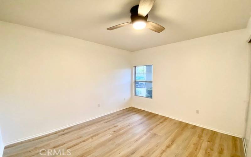 Secondary bedroom has new flooring throughout.