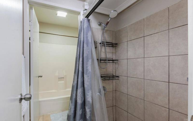 Bathroom upstairs with bath tub and shower