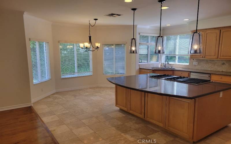 Kitchen with an informal eating nook with many windows