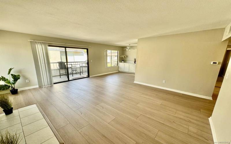 The living room has a sliding glass door to the patio and the laundry closet with a full size washer and dryer.