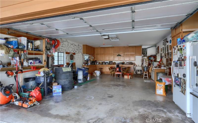 Two car garage, automatic garage door opener, storage cabinets and pellet stove!