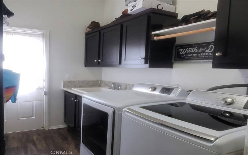 The laundry area, has access to the back yard.