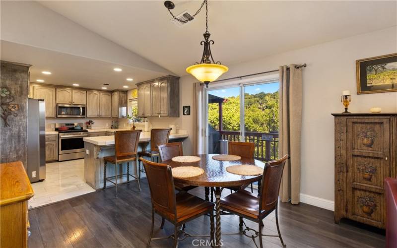 Dining area with sliding glass doors leading to deck