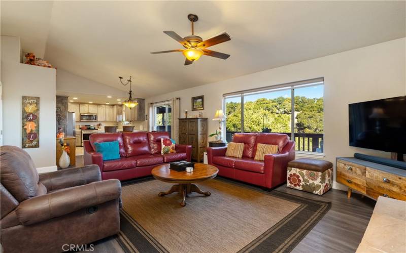 View looking from family room into dining area and kitchen