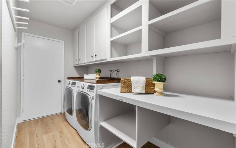 Laundry room with built-ins.