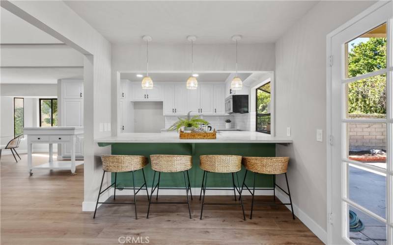 Kitchen with seating at the counter.