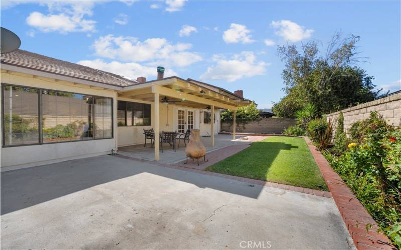 Backyard with covered patio.