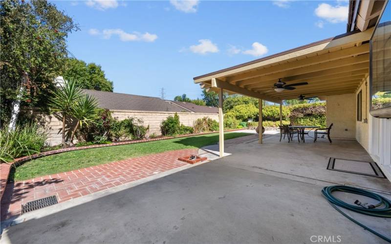 Backyard with covered patio.