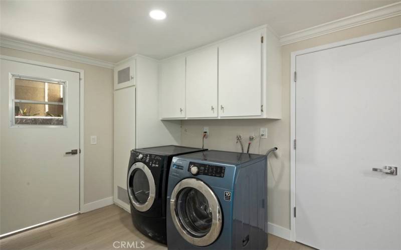 The inside Laundry room is just off the family room/kitchen. Door to garage is on right.