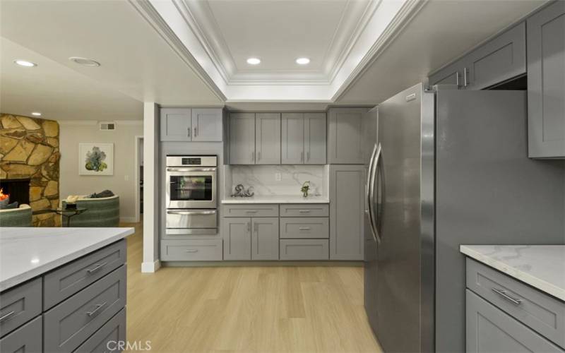 From kitchen sink looking across to Double oven and scullery area.