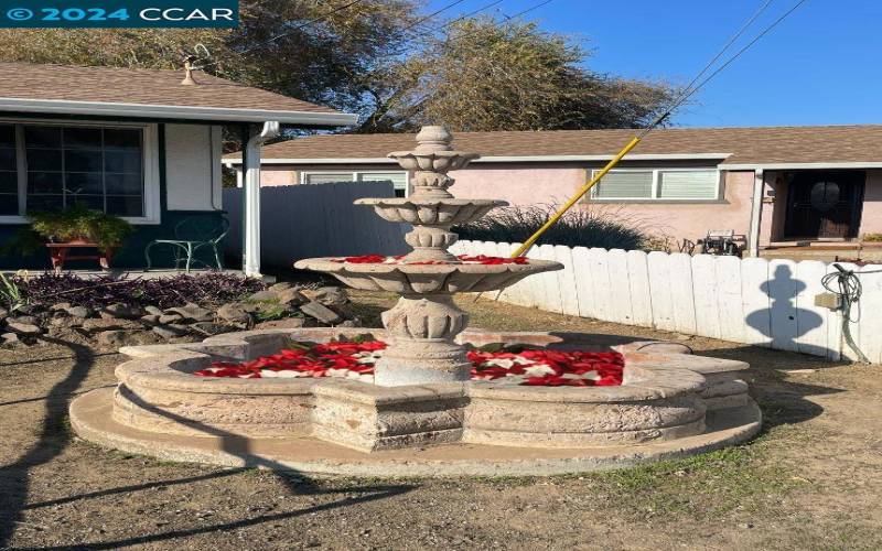 Here's a virtually staged photo of the fountain as a multi-layered garden!