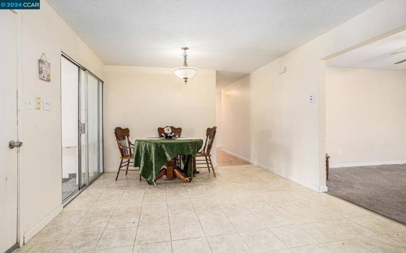 Combination kitchen and dining area.  Slider leads to bonus room and large covered patio