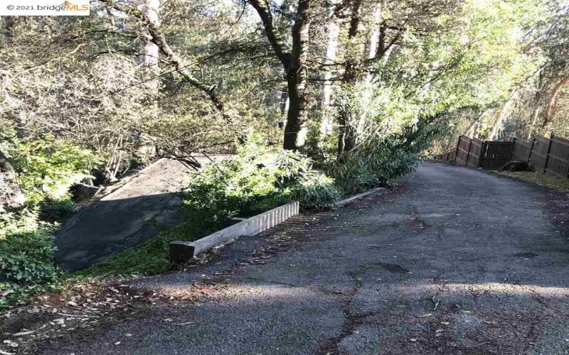 View from further down driveway: turn visible.