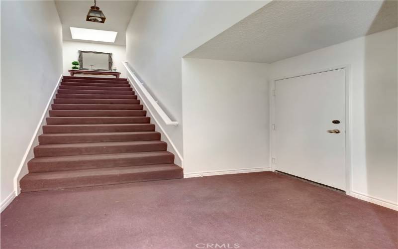 Access to the unit from the frond door and the garage. The door on the right belongs to he unit.