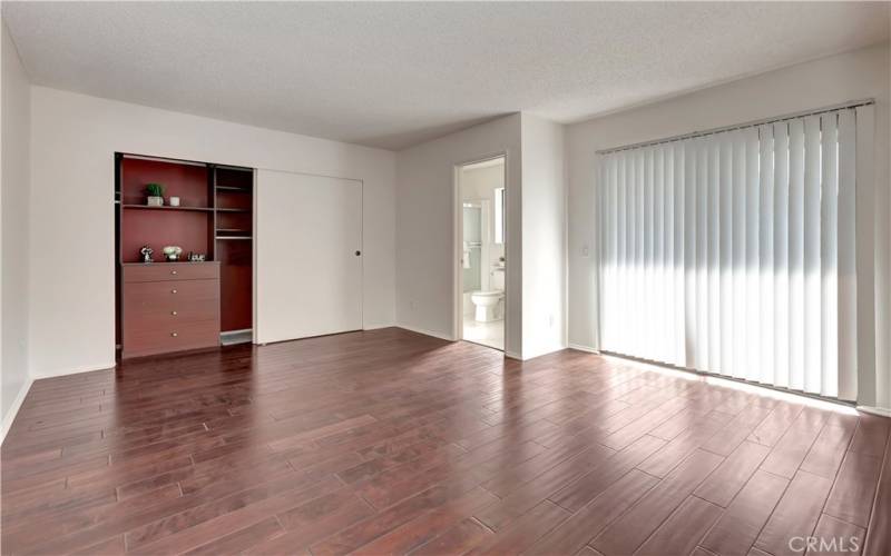 Master Bedroom with built-ins in wall to wall closet.