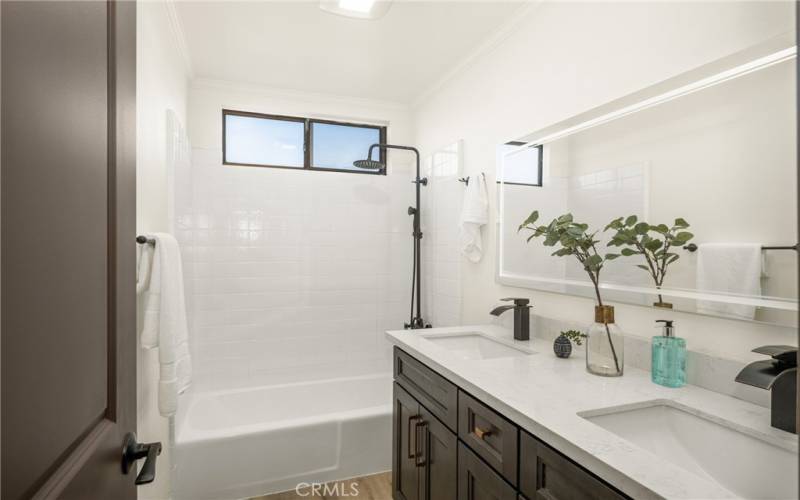 Accommodating Guest Bath with Lots of Storage and a Touch Light Mirror