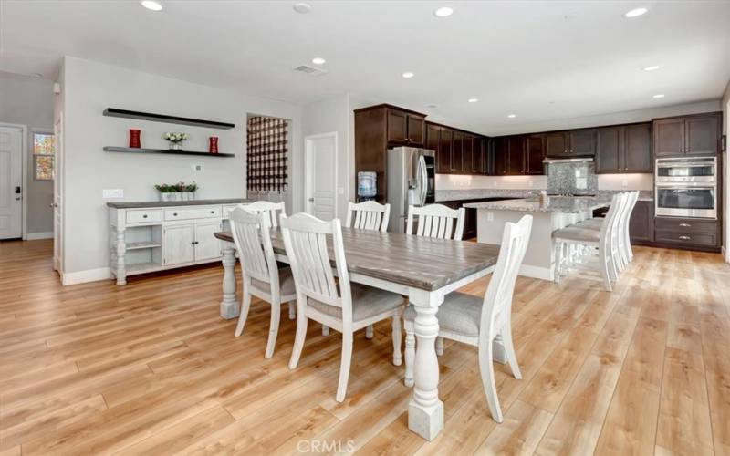 Kitchen breakfast bar allows a second informal eating area.