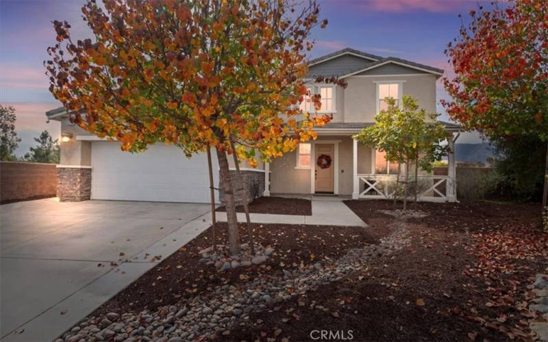 Nice long driveway through a low maintenance front yard.