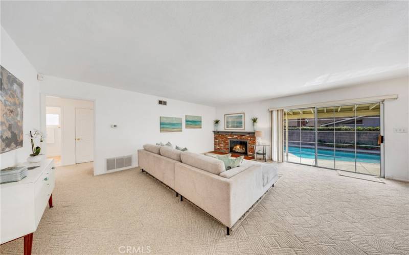 Your living room with fireplace  and a window to the water.