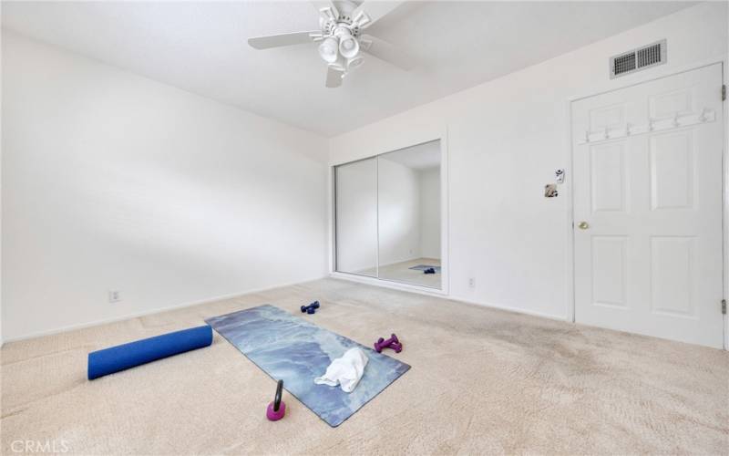 Full closet with organizational system, this room on East side of house with the 3/4 bath next to it.