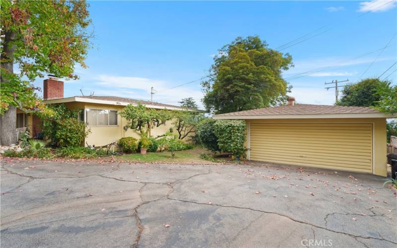 Long private driveway with 2 car detached garage