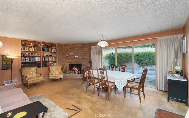 Family room with fireplace, built ins and sliding glass doors with mountain views