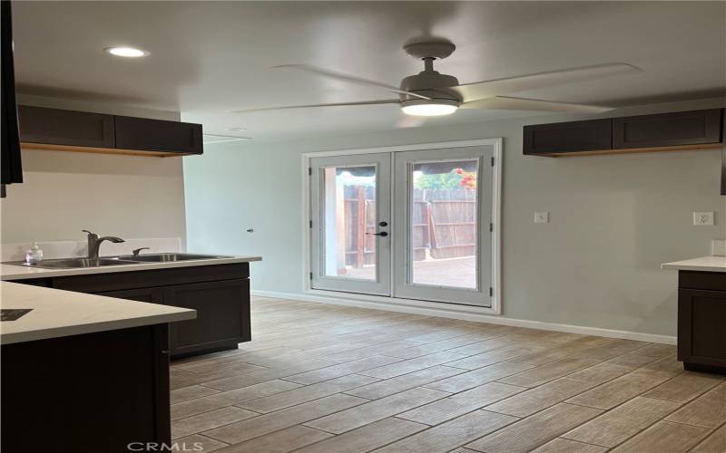 Kitchen , door leading to private patio area