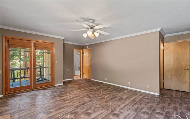 Primery Bedroom showing deck entrance on left, access to lower level  on right