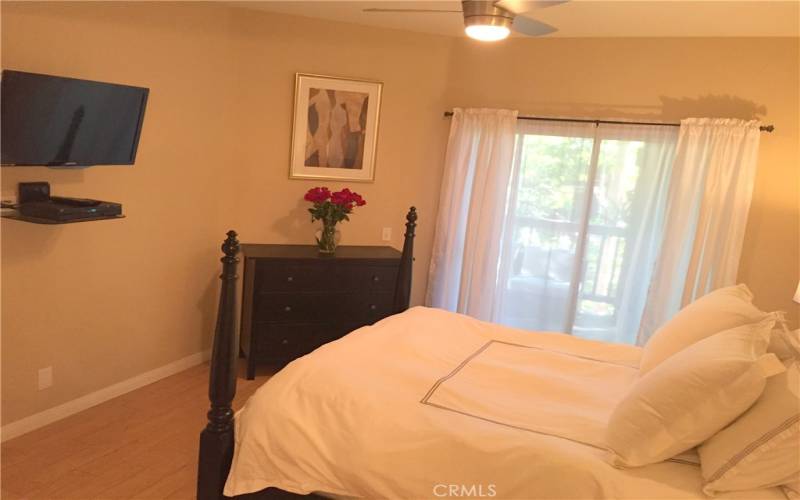 Bedroom with sliding glass door leading to your private balcony