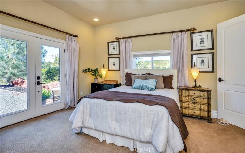 Downstairs bedroom opens to bathroom and outside garden area.