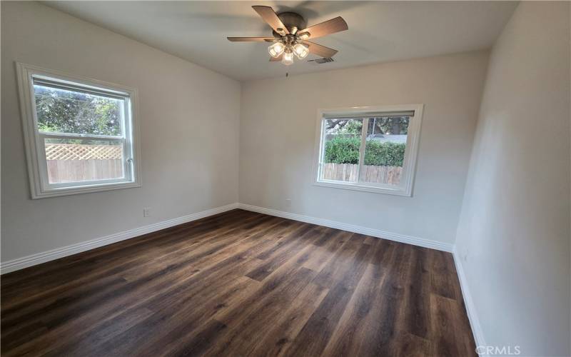 The second guest bedroom located at the back of the house is bright and inviting.