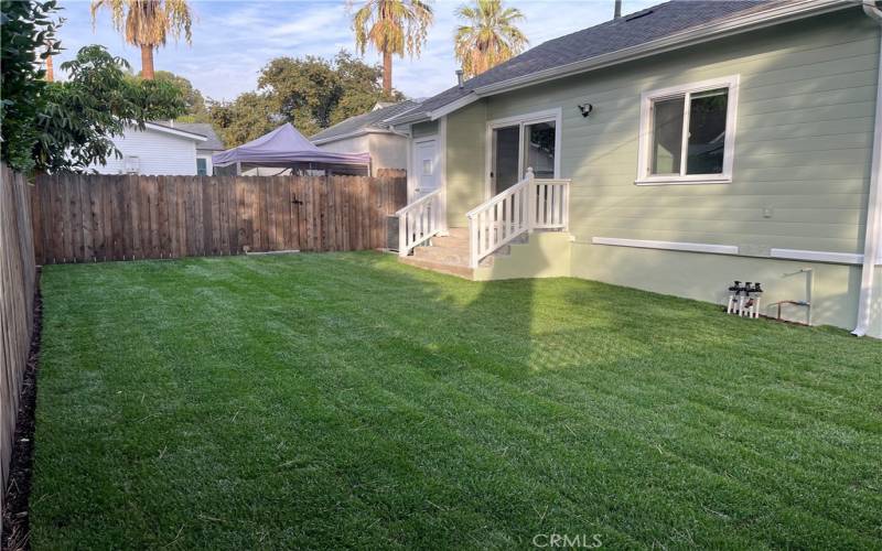 Newly installed sod in this spacious private backyard.