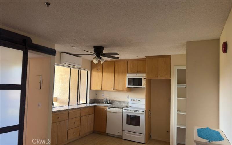 Non Virtual, kitchen and pantry. Left side barn door to give some privacy to the bathroom, hall and balcony door.