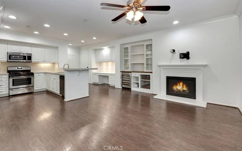 From dining room towards fireplace, built-in storage, wine frig, desk - wonderfully convenient!