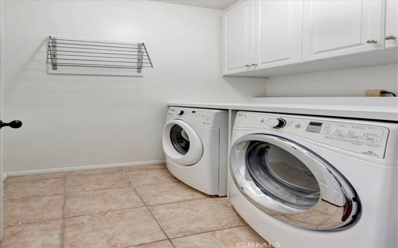 Laundry room - own room with cabinets/storage