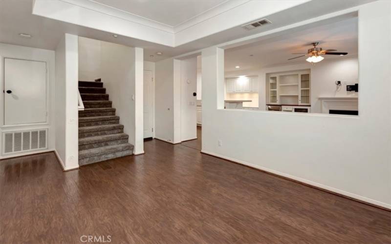 Dining room view of stairwell up to primary suite