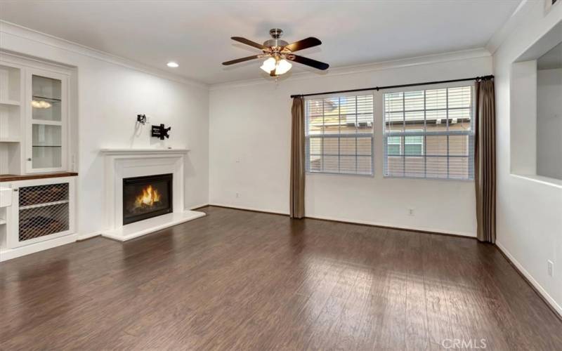 Existing living room with crackling fireplace, wine cooler, built-in desk plus storage unit - lighting in bookshelves - VERY NICE!