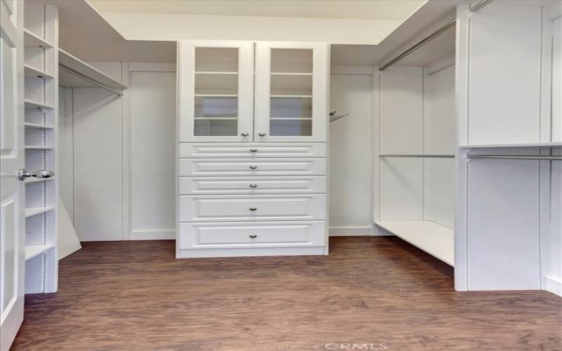 Primary closet with all sorts of organizers built-in