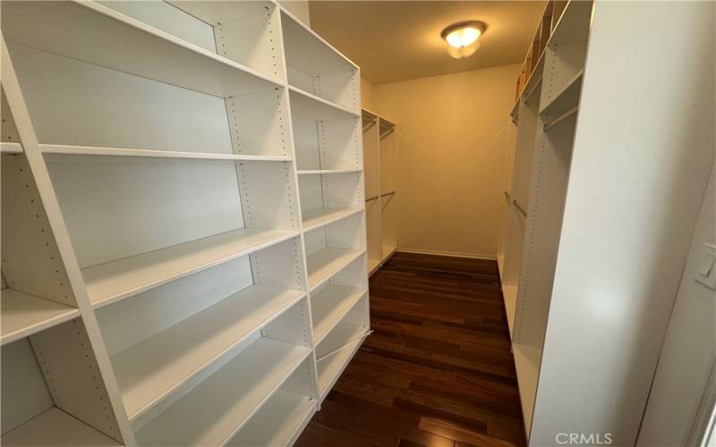 Primary bedroom walk in closet