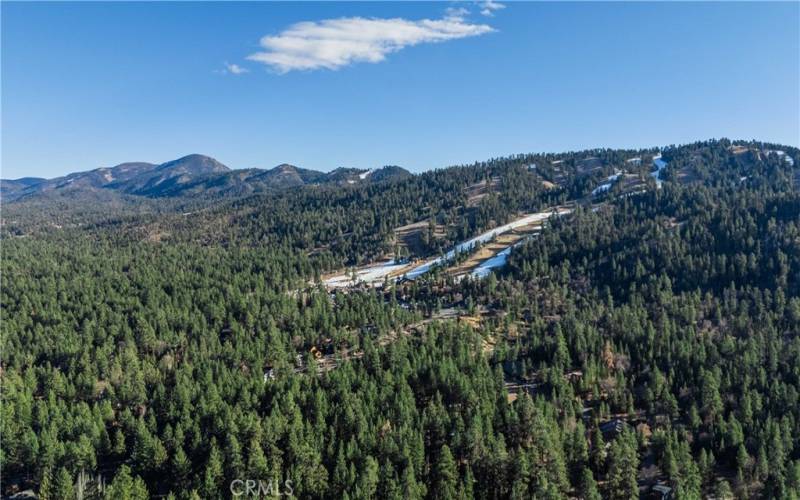 Drone view from above the cabin. Snow summit close by!