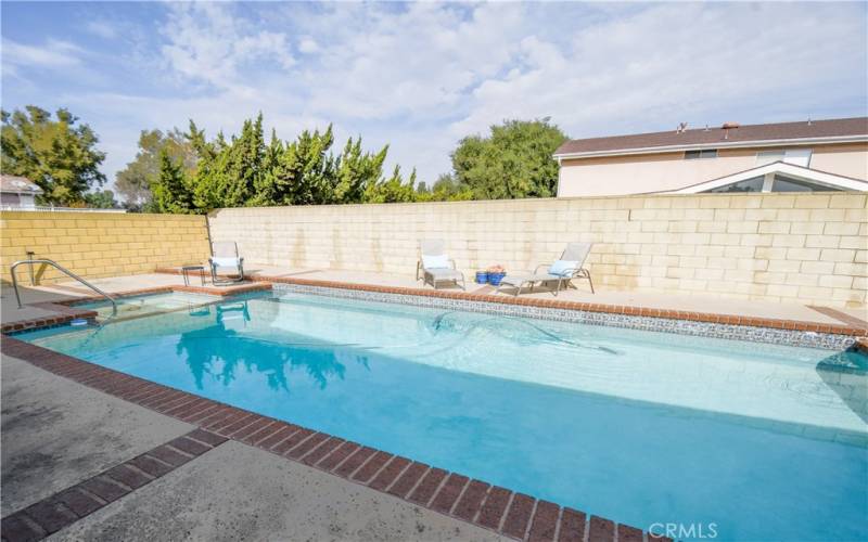 Peaceful and Serene Backyard with Beautiful Pool / Spa with a View of Hills in the Distance.