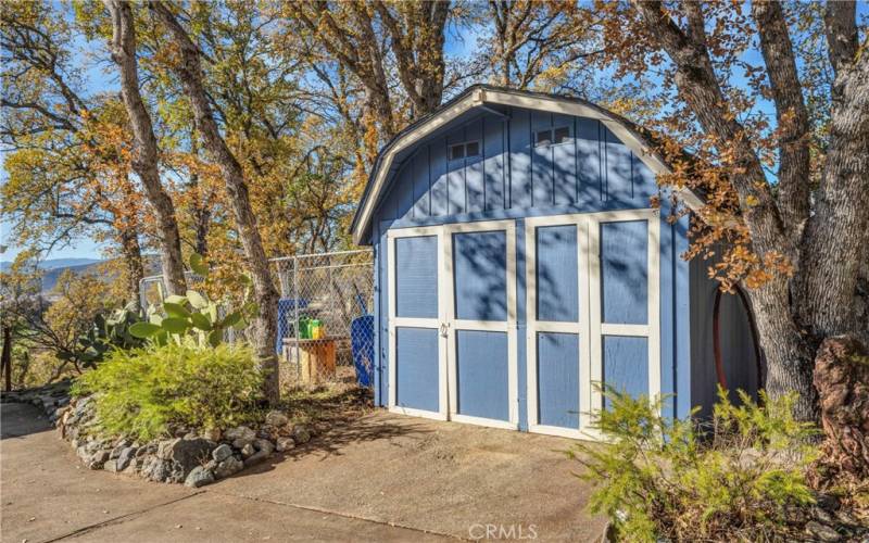 Storage shed between the 2 parking areas.