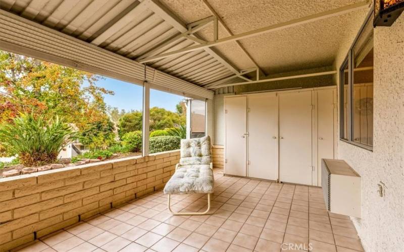 Large cabinets on the patio offer plenty of storage options.